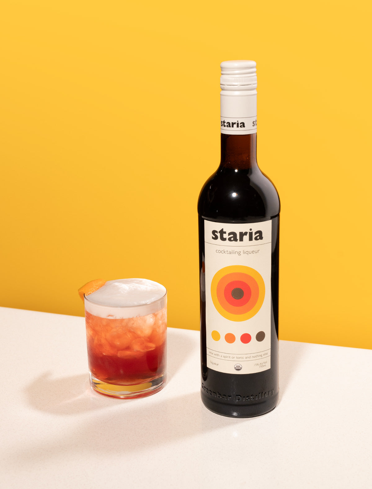 Staria bottle with whiskey sour